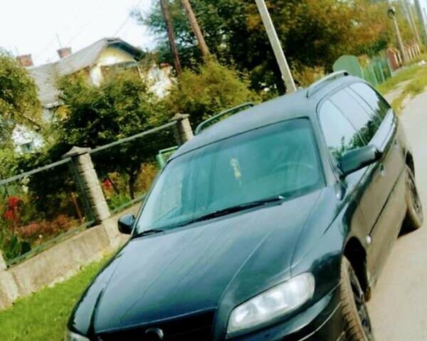 Черный Опель Омега, объемом двигателя 2.2 л и пробегом 220 тыс. км за 3000 $, фото 1 на Automoto.ua