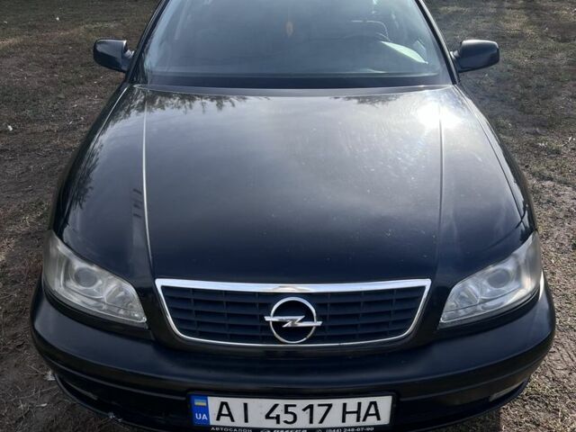Черный Опель Омега, объемом двигателя 2.5 л и пробегом 300 тыс. км за 4000 $, фото 1 на Automoto.ua
