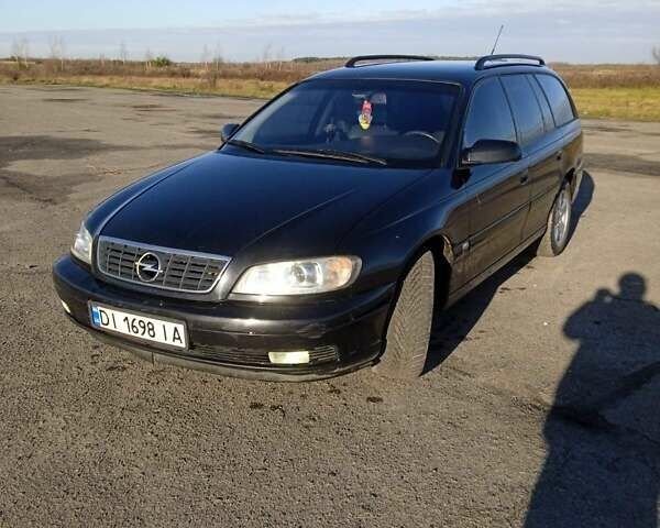 Черный Опель Омега, объемом двигателя 2.5 л и пробегом 334 тыс. км за 3800 $, фото 1 на Automoto.ua