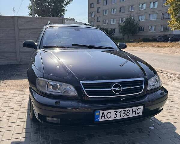 Черный Опель Омега, объемом двигателя 2.2 л и пробегом 330 тыс. км за 3500 $, фото 1 на Automoto.ua