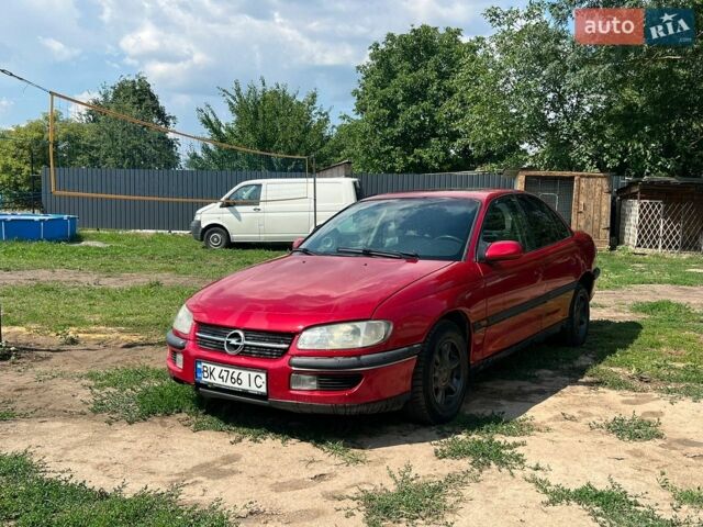 Червоний Опель Омега, об'ємом двигуна 2 л та пробігом 300 тис. км за 1550 $, фото 1 на Automoto.ua