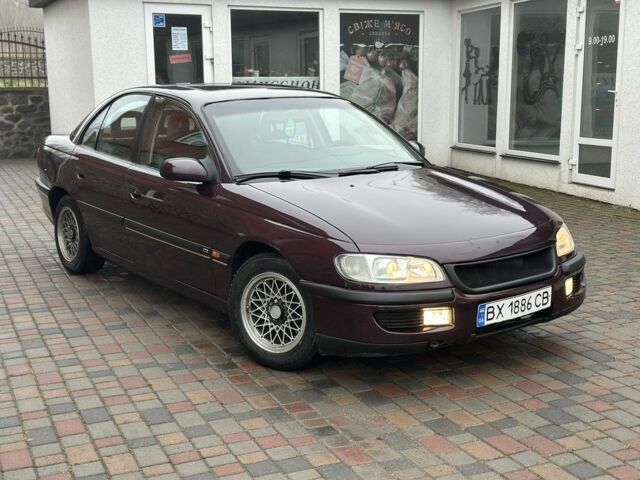 Червоний Опель Омега, об'ємом двигуна 2 л та пробігом 301 тис. км за 2200 $, фото 1 на Automoto.ua