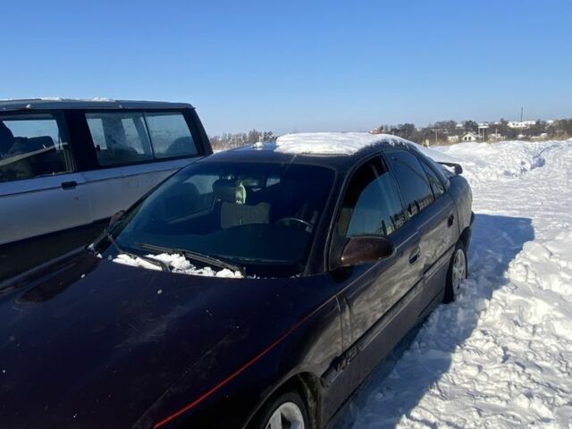 Красный Опель Омега, объемом двигателя 2.5 л и пробегом 300 тыс. км за 600 $, фото 1 на Automoto.ua