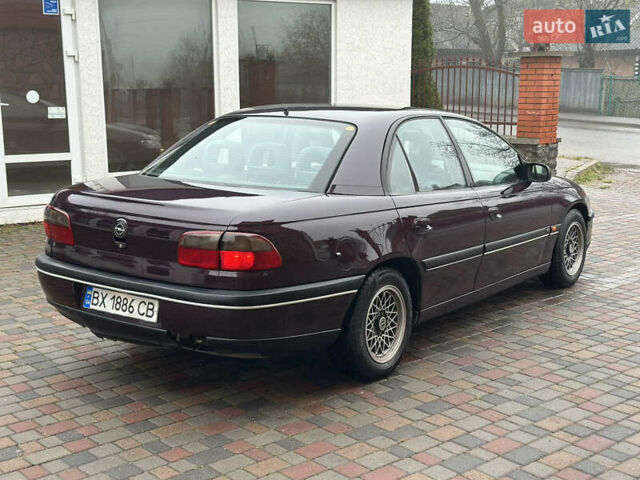 Красный Опель Омега, объемом двигателя 2 л и пробегом 310 тыс. км за 1800 $, фото 1 на Automoto.ua