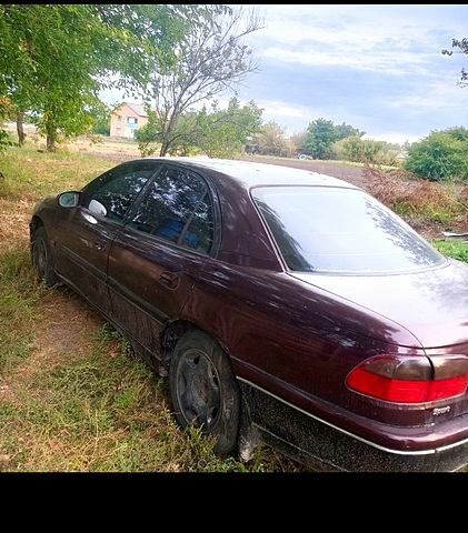 Красный Опель Омега, объемом двигателя 3 л и пробегом 300 тыс. км за 1100 $, фото 1 на Automoto.ua