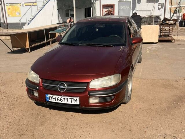 Красный Опель Омега, объемом двигателя 2.5 л и пробегом 385 тыс. км за 2300 $, фото 1 на Automoto.ua