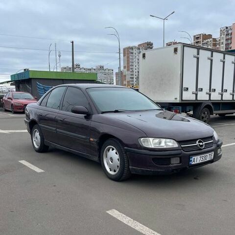 Красный Опель Омега, объемом двигателя 2 л и пробегом 280 тыс. км за 2400 $, фото 1 на Automoto.ua