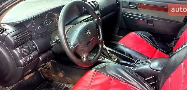 Красный Опель Омега, объемом двигателя 2 л и пробегом 300 тыс. км за 1500 $, фото 1 на Automoto.ua