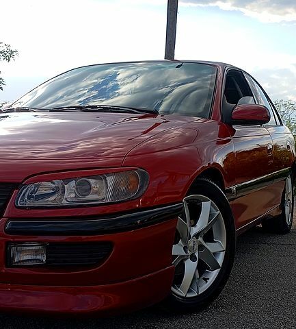 Красный Опель Омега, объемом двигателя 2.5 л и пробегом 360 тыс. км за 3300 $, фото 1 на Automoto.ua