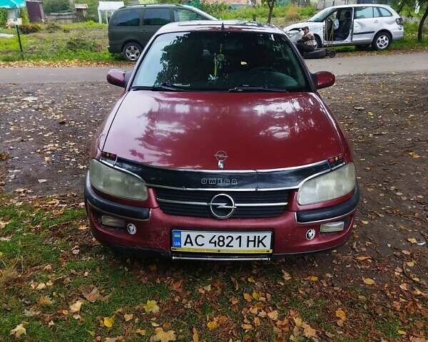 Червоний Опель Омега, об'ємом двигуна 2 л та пробігом 300 тис. км за 2200 $, фото 1 на Automoto.ua