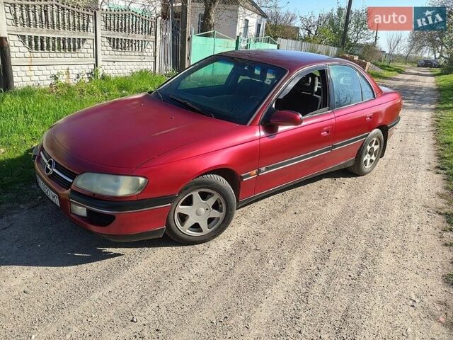 Красный Опель Омега, объемом двигателя 2.5 л и пробегом 300 тыс. км за 1500 $, фото 1 на Automoto.ua