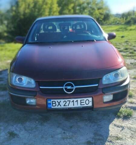 Красный Опель Омега, объемом двигателя 2 л и пробегом 257 тыс. км за 2100 $, фото 1 на Automoto.ua