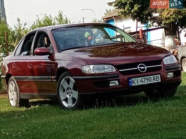 Красный Опель Омега, объемом двигателя 2.5 л и пробегом 352 тыс. км за 3300 $, фото 1 на Automoto.ua