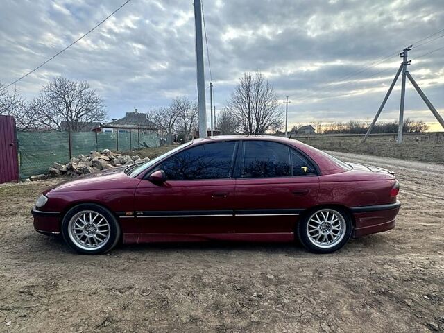 Красный Опель Омега, объемом двигателя 3 л и пробегом 100 тыс. км за 2600 $, фото 1 на Automoto.ua