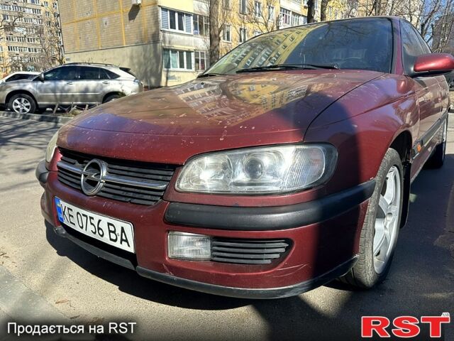 Червоний Опель Омега, об'ємом двигуна 2 л та пробігом 400 тис. км за 1550 $, фото 1 на Automoto.ua