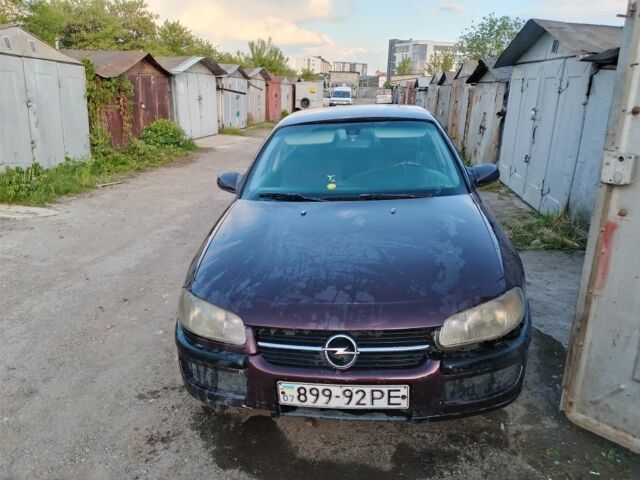Красный Опель Омега, объемом двигателя 2 л и пробегом 350 тыс. км за 850 $, фото 1 на Automoto.ua