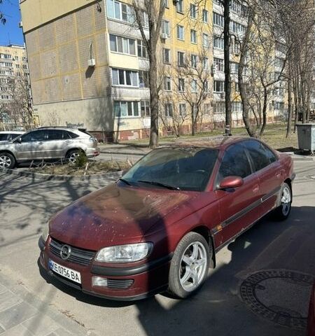 Красный Опель Омега, объемом двигателя 2 л и пробегом 100 тыс. км за 1750 $, фото 1 на Automoto.ua