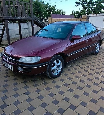 Червоний Опель Омега, об'ємом двигуна 2.5 л та пробігом 317 тис. км за 1900 $, фото 1 на Automoto.ua