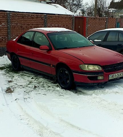 Червоний Опель Омега, об'ємом двигуна 2 л та пробігом 285 тис. км за 1800 $, фото 1 на Automoto.ua