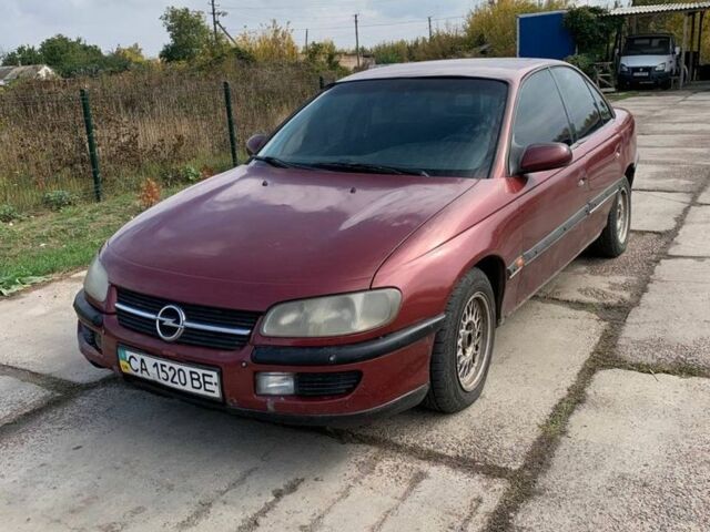 Червоний Опель Омега, об'ємом двигуна 2 л та пробігом 250 тис. км за 1500 $, фото 1 на Automoto.ua