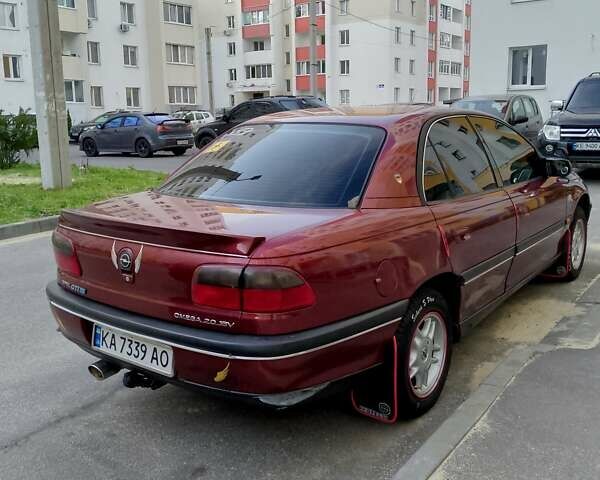 Красный Опель Омега, объемом двигателя 2 л и пробегом 100 тыс. км за 2700 $, фото 1 на Automoto.ua