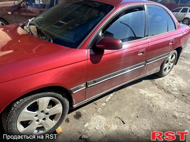 Червоний Опель Омега, об'ємом двигуна 2.5 л та пробігом 290 тис. км за 2000 $, фото 1 на Automoto.ua
