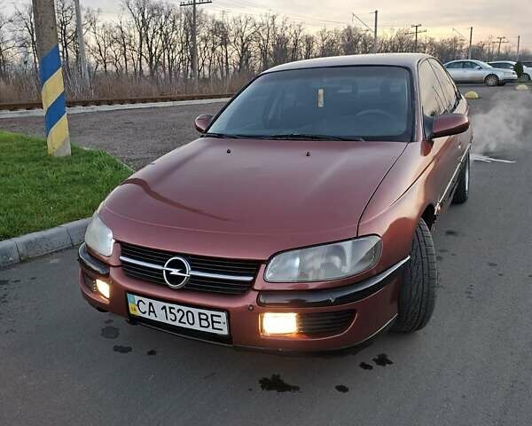 Красный Опель Омега, объемом двигателя 2 л и пробегом 400 тыс. км за 2390 $, фото 1 на Automoto.ua