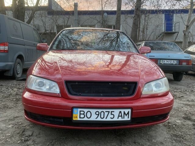 Красный Опель Омега, объемом двигателя 2.2 л и пробегом 320 тыс. км за 1900 $, фото 1 на Automoto.ua