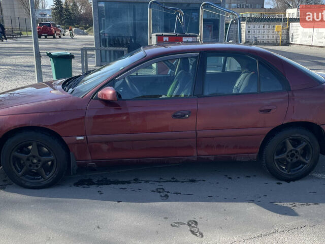 Красный Опель Омега, объемом двигателя 2.2 л и пробегом 354 тыс. км за 2600 $, фото 1 на Automoto.ua