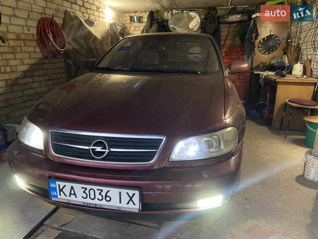 Красный Опель Омега, объемом двигателя 2.6 л и пробегом 330 тыс. км за 1700 $, фото 1 на Automoto.ua