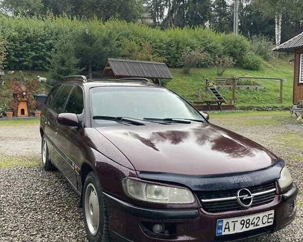 Красный Опель Омега, объемом двигателя 2 л и пробегом 250 тыс. км за 1100 $, фото 1 на Automoto.ua