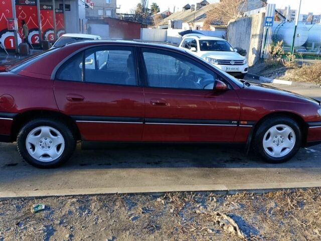 Червоний Опель Омега, об'ємом двигуна 2 л та пробігом 270 тис. км за 2400 $, фото 1 на Automoto.ua