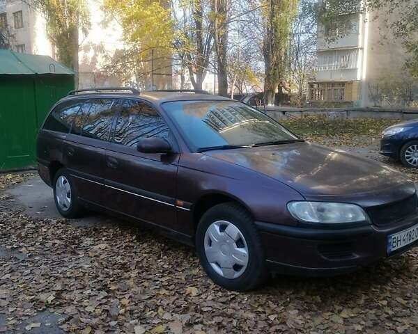 Червоний Опель Омега, об'ємом двигуна 2 л та пробігом 298 тис. км за 2500 $, фото 1 на Automoto.ua