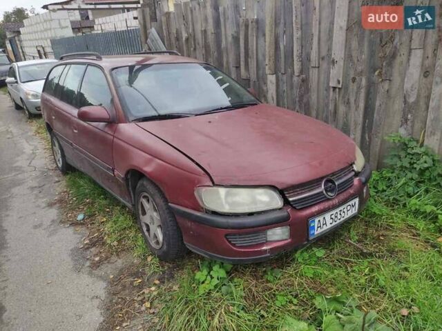 Красный Опель Омега, объемом двигателя 2 л и пробегом 300 тыс. км за 1800 $, фото 1 на Automoto.ua
