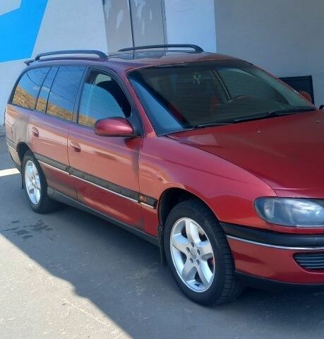 Червоний Опель Омега, об'ємом двигуна 2 л та пробігом 350 тис. км за 1500 $, фото 1 на Automoto.ua