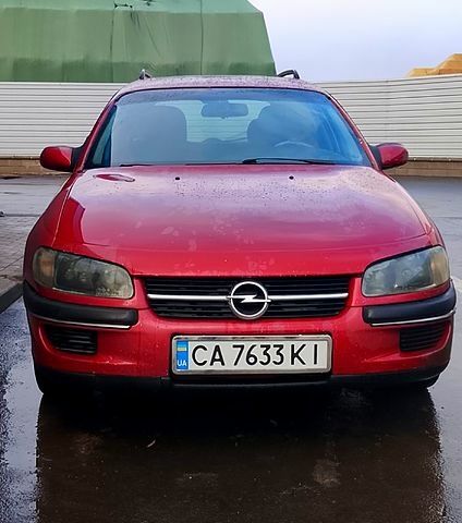 Червоний Опель Омега, об'ємом двигуна 2 л та пробігом 400 тис. км за 1450 $, фото 1 на Automoto.ua