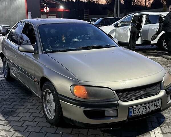 Серый Опель Омега, объемом двигателя 3 л и пробегом 253 тыс. км за 1900 $, фото 1 на Automoto.ua