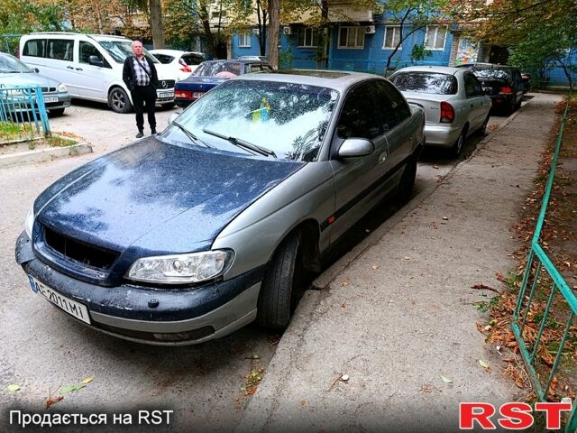 Сірий Опель Омега, об'ємом двигуна 2 л та пробігом 355 тис. км за 1100 $, фото 1 на Automoto.ua