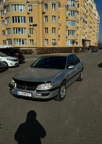 Серый Опель Омега, объемом двигателя 2.5 л и пробегом 230 тыс. км за 2700 $, фото 1 на Automoto.ua