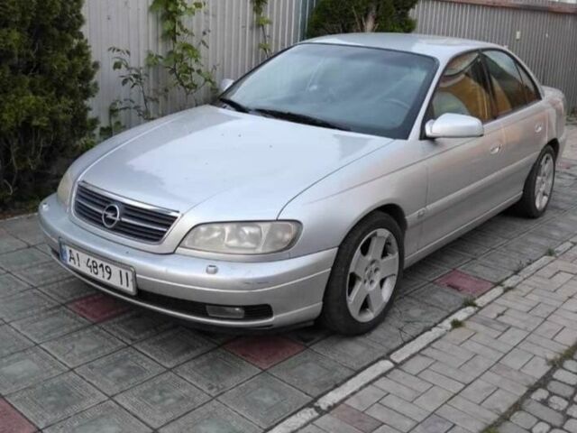 Серый Опель Омега, объемом двигателя 2.2 л и пробегом 290 тыс. км за 2100 $, фото 1 на Automoto.ua