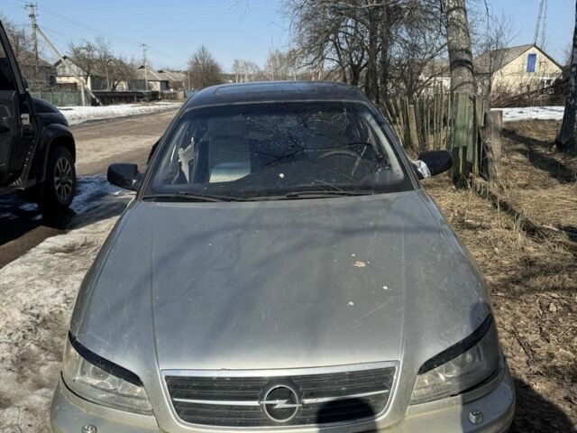 Серый Опель Омега, объемом двигателя 2.6 л и пробегом 260 тыс. км за 900 $, фото 1 на Automoto.ua