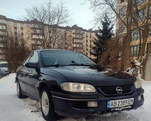Синий Опель Омега, объемом двигателя 2 л и пробегом 320 тыс. км за 1400 $, фото 1 на Automoto.ua