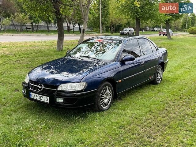 Синий Опель Омега, объемом двигателя 2.5 л и пробегом 250 тыс. км за 1550 $, фото 1 на Automoto.ua