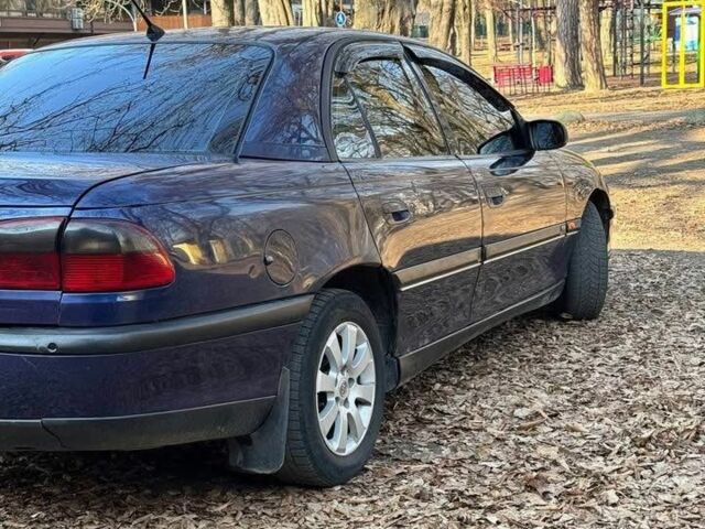 Синий Опель Омега, объемом двигателя 2 л и пробегом 355 тыс. км за 1500 $, фото 1 на Automoto.ua