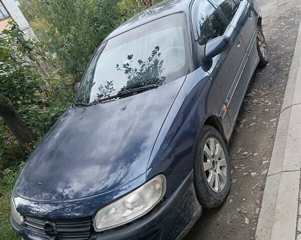 Синий Опель Омега, объемом двигателя 2.5 л и пробегом 350 тыс. км за 1450 $, фото 1 на Automoto.ua
