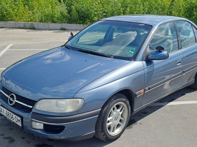 Синий Опель Омега, объемом двигателя 2 л и пробегом 258 тыс. км за 2200 $, фото 1 на Automoto.ua