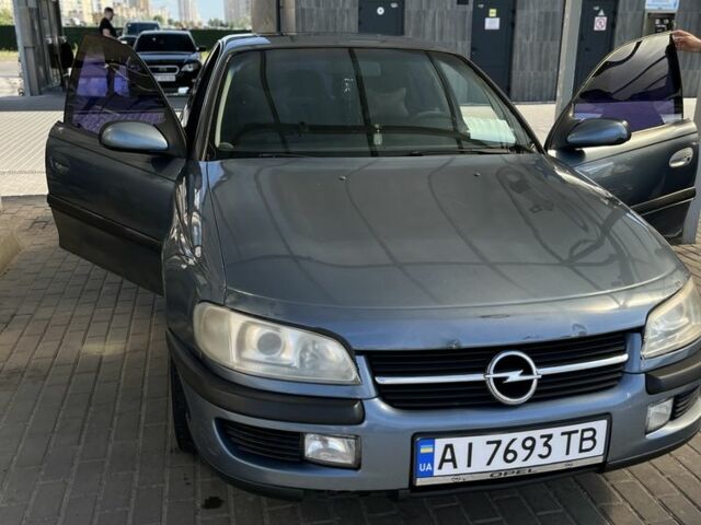 Синий Опель Омега, объемом двигателя 2 л и пробегом 300 тыс. км за 1750 $, фото 1 на Automoto.ua