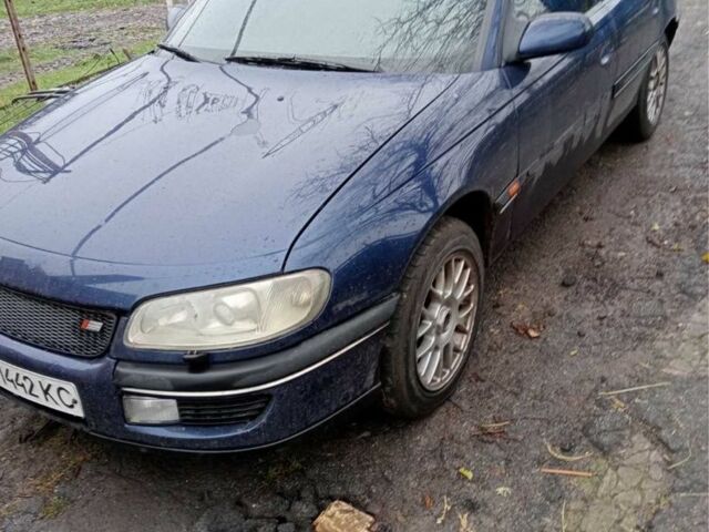Синий Опель Омега, объемом двигателя 3 л и пробегом 460 тыс. км за 1100 $, фото 1 на Automoto.ua