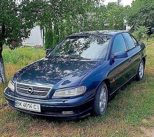 Синий Опель Омега, объемом двигателя 2.2 л и пробегом 315 тыс. км за 3000 $, фото 1 на Automoto.ua