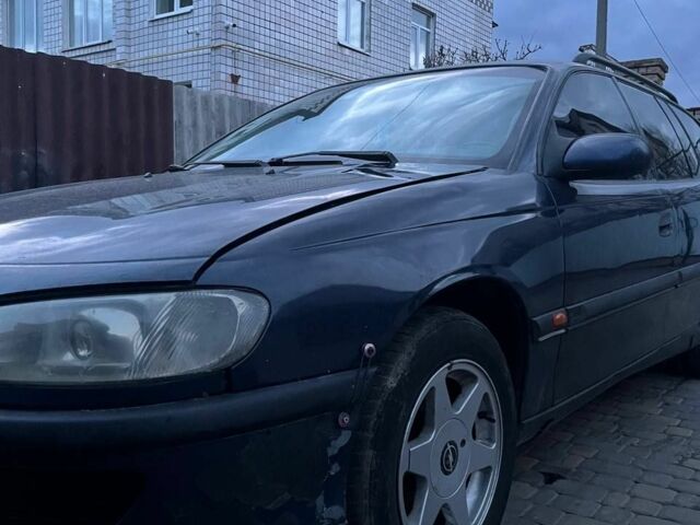 Синий Опель Омега, объемом двигателя 2.5 л и пробегом 200 тыс. км за 565 $, фото 1 на Automoto.ua